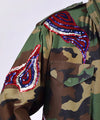 Customised vintage camo military jacket with coloured sequins - detail view